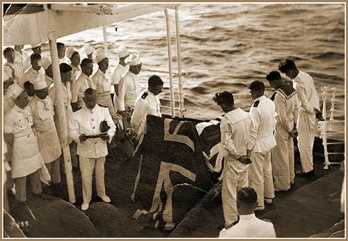 Burial at Sea on the RMS Britanic. Captain Brown Reading the Scripture, 1933.