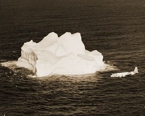 A U.S. Coast Guard HC-1308 "Hercules" Plane Tracks an Iceberg in the Grand Banks Region During a Recent Ice Patrol Flight, February 1964.