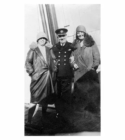 Miss V. Mulholland and Friend Pose with the Chief Officer of the SS Lapland