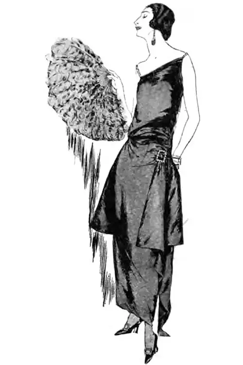 For Wear at Small Informal Dinners, Mlle. Trezel Includes in Her Trousseau This Paton Gown of Very Shiny Black Satin, Draped and Held by a Buckle of Strass. Vogue Magazine, 1 April 1922.