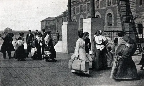 Immigrants Walking from the Barge Landing to the Main Building at the Ellis Island Immigrant Station.