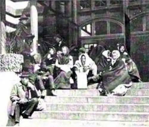 Immigrants Lounging on the Steps of the Immigrant Station.