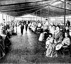 Women and Childing Passing the Time in the Detention Pen in the Cool and Airy Roof Garden at Ellis Island.