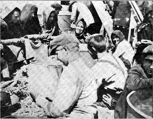 Immigrants in the Steerage Peeling Potatoes on Deck.