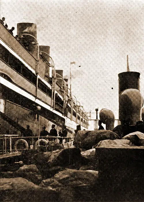 Transhipping Stacks of Sacks Containing American Mail to the SS Kaiser Wilhelm II at Plymouth, England.