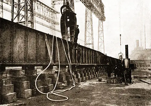 Fig. 15: Hydraulic Riveter at Work on the Vertical Keel Plate.