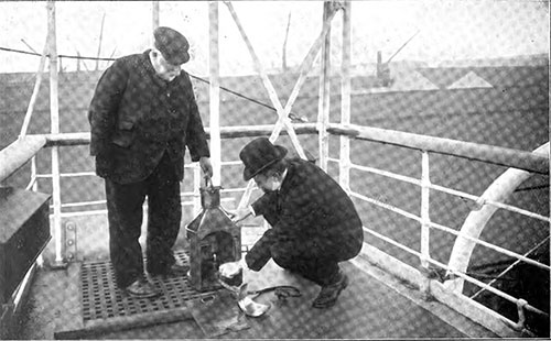 The Inspector Examines One of the Ship's Lamps.