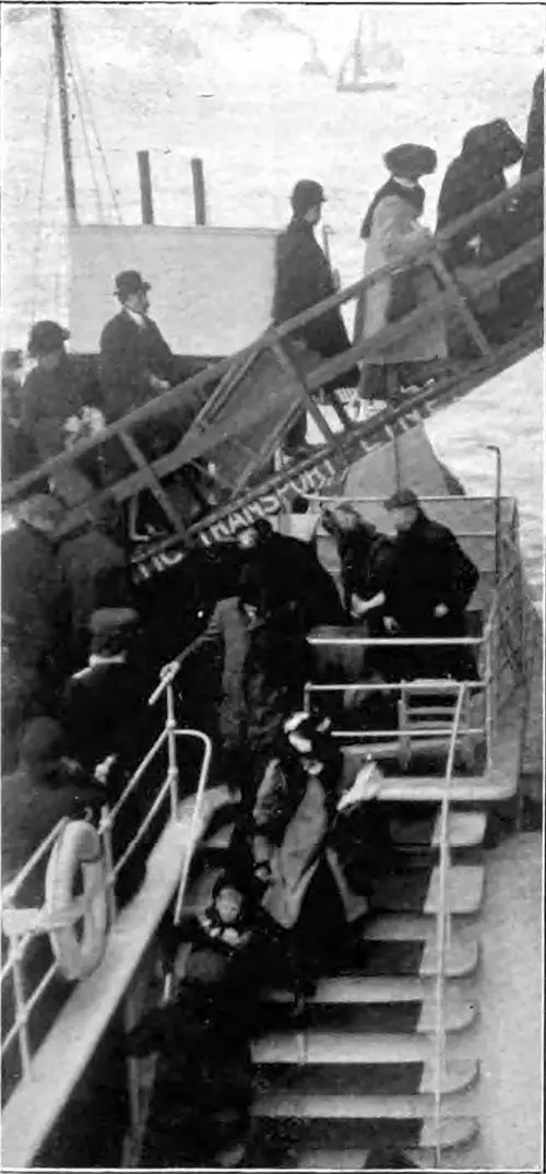 Passengers Board a Large Tender to be Taken Out to the Ship.
