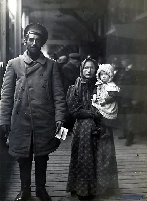 Dutch Immigrant Family Arrving in Steerage at Ellis Island. Father, Mother, and Infant.