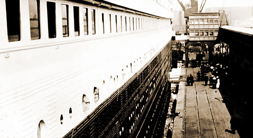 The Titanic Docked in Southampton, Loading Passengers, Luggage, Mail, and Other Cargo Before Beginning Her Journey to New York - 10 April 1912.