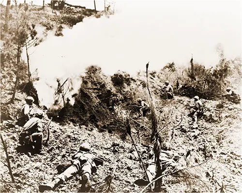 Trapped--rifle Sights Lined on the Entrance to an Okinawan Cave, Marines Await the Results of an Explosive Charge to Pick off Any Japs Who Attempt to Escape.