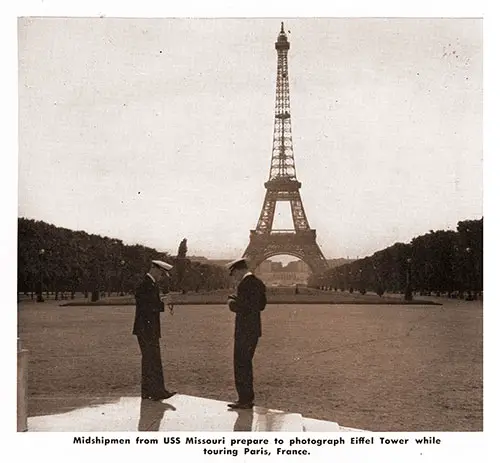 Midshipmen from USS Missouri prepare to photograph Eiffel Tower while touring Paris, France.