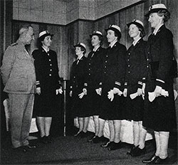 GGA Image ID # 134b0da282 Rear Admiral Randall Jacobs, USN, Chief of the Bureau of Naval Personnel, inspects the new uniforms of the Women’s Reserve.