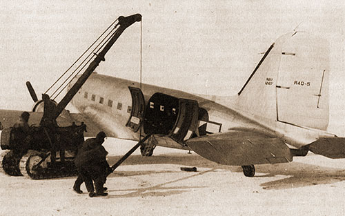 1122a: Navy Air Transportation in the Artic. Unloading Pipe for the Navy at Point Barrow.