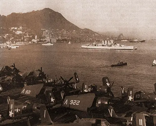 Seen Across the Flight Deck of a U. S. Carrier Is the City and Harbor of Hong Kong.
