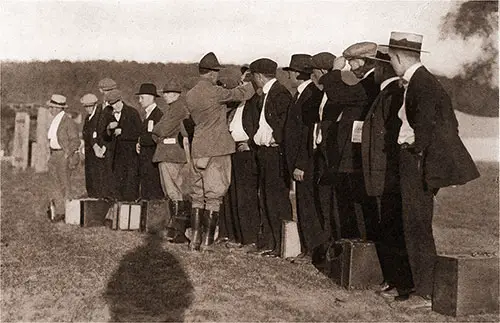 Let's See Your Teeth -- Non-Commissioned Officers Check Out the New Batch of Recruits.