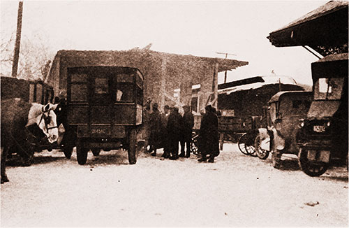View of Automobile Row at the Training Station at Ayer, Where Jitney Drivers Stand Read to Take Soldiers to Camp -- for a Price.