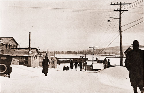 The Street in the Picture Runs Through the Barracks of the 302d Infantry, and Connects the Regimental Street in Front With the Highway in the Rear.