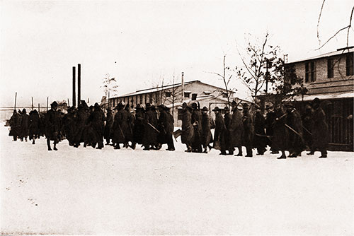 A Company From the 303d Infantry Returning to the Barracks for Mess, After Several Hours of Strenuous "Fatigue Duty."