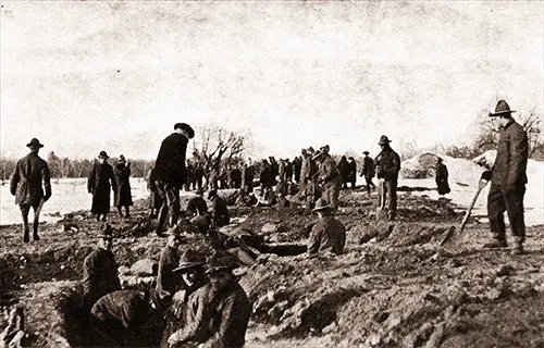 At the Trenches. Men From the 303d Infantry Are Seen Digging a First-Line Trench.