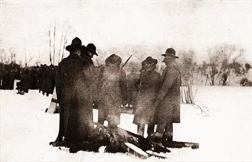 Keeping Warm. When the Temperature Drops at the Trenches, the Men Gather Brush and Old Boards and Do Their Best to Keep Warm.