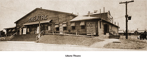 View of the Liberty Theatre Building. An Abundance of Placards Describe the Current and Upcoming Shows.