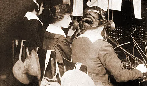 On Duty at St. Mihiel. American Telephone Operators on Duty at First Army Headquarters, Equipped with Gas Masks and Helmets Ready for Use at a Moments Notice. Official US Army Photograph. Circuits of Victory, 1921.