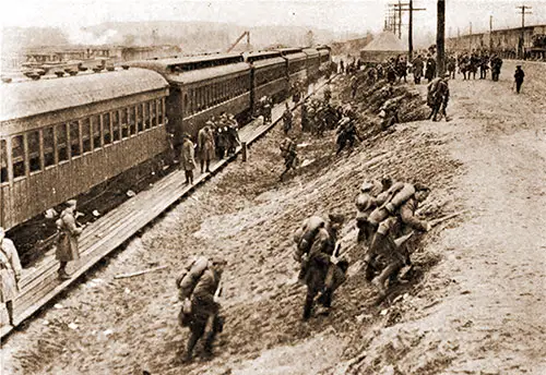 "Over the Top" for the Last Time, and Into the Arms of Their Waiting Families--Overseas Men Returning to Camp Devens for Discharge.