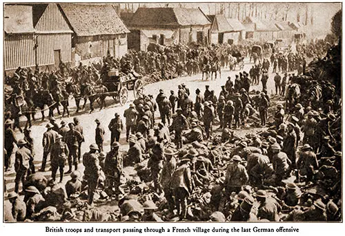 British Troops and Transport Passing through a French Village during the Last German Offensive.