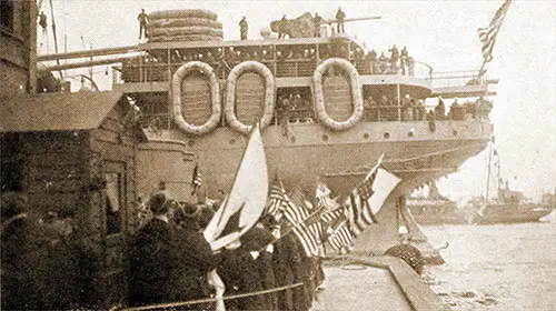 Transport Ship Laden with Soldiers Departs for France, Friends and Family Members on the Pier Cheer On the Men.