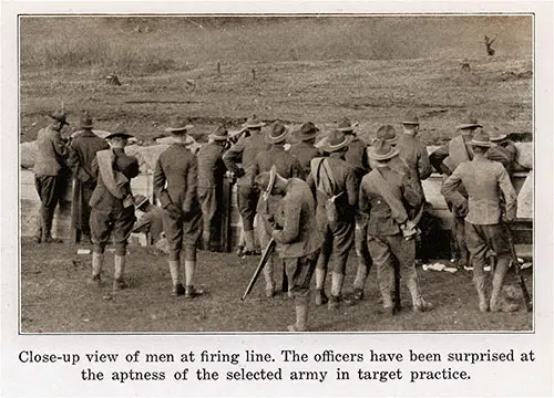Close-up view of men at firing line. The officers have been surprised at the aptness of the selected army in target practice.