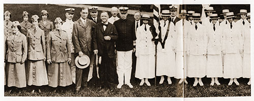 Yeomen (F) and U. S. Marine Corps Women Reserves (Marinettes) at their final review by Secretary of the Navy Josephus Daniels (center) and then-Assistant Secretary of the Navy Franklin D. Roosevelt (left, holding hat).