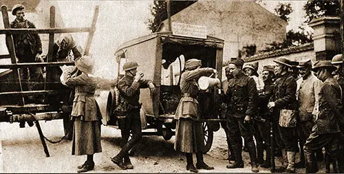 French Refugees and French and American Soldiers Alike Receiving Chocolate from One of the Traveling Canteens of the American Committee