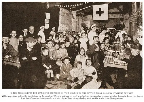 A Red Cross Supper for War-Zone Refugees in the Cellar of One of the Great Railway Stations of Paris.