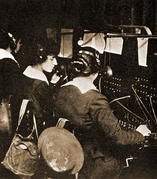 On Duty; St. Mihiel Drive. American Telephone Operators on Duty within Gas Zone, with Gas Masks and Helmets.