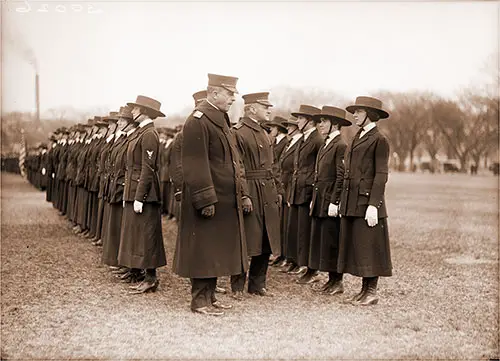 Rear Admiral Victor Blue (Left Center) Chief of the Bureau of Navigation, Inspects Yeomen (F) on the Grounds of the Washington Monument, Washington, DC, in 1918.