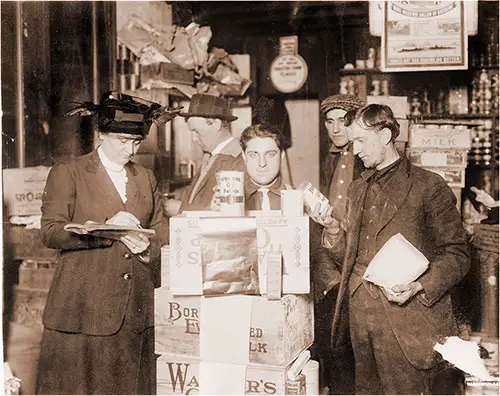 Woman in the Red Cross Commission's Warehouses at Rotterdam, Holland Giving American Canned Food To Refugees, c1918.