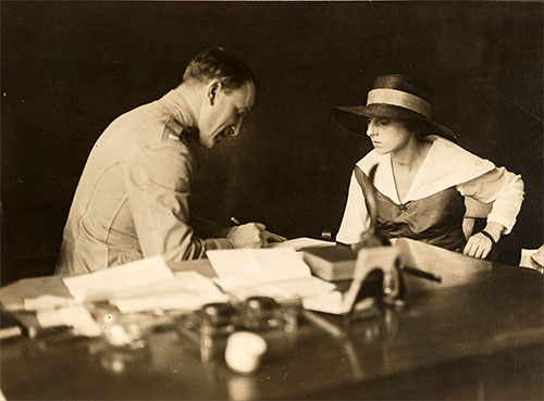 A Recruiting Officer is Swearing In One of the Female Recruits, August 1918.