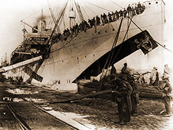 Men of the 43rd Railway Artillery Going Aboard the USS Princess Matoika, Bound for the United States at St. Nazaire, Loire Inferieure, France.