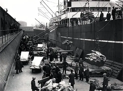 Loading Provisions, Supplies, and Cargo onto a Steamship ca 1915